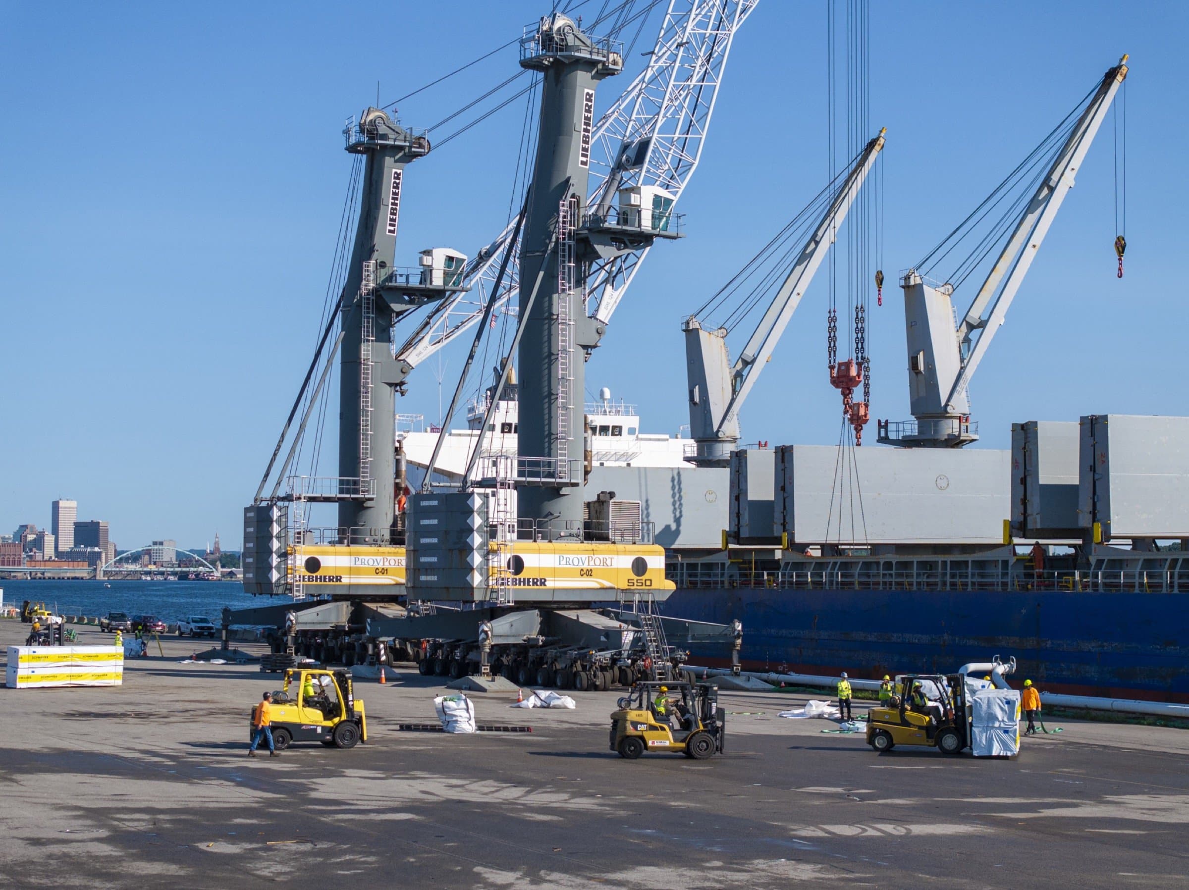 port workers unloading lumber